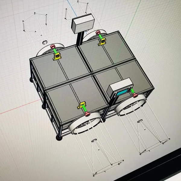 A recoiler CAD model showing its frame, two drum assemblies, and controls.
